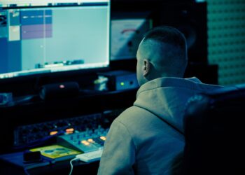 man typing on computer