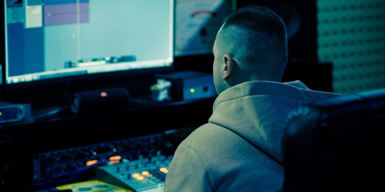 man typing on computer