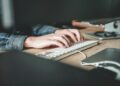 person using computer keyboard