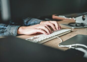 person using computer keyboard