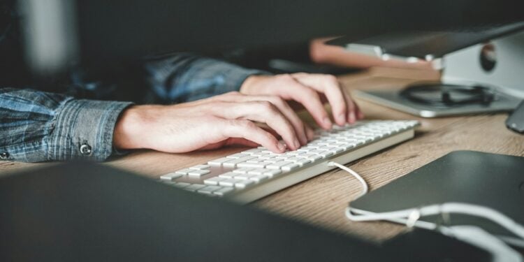 person using computer keyboard
